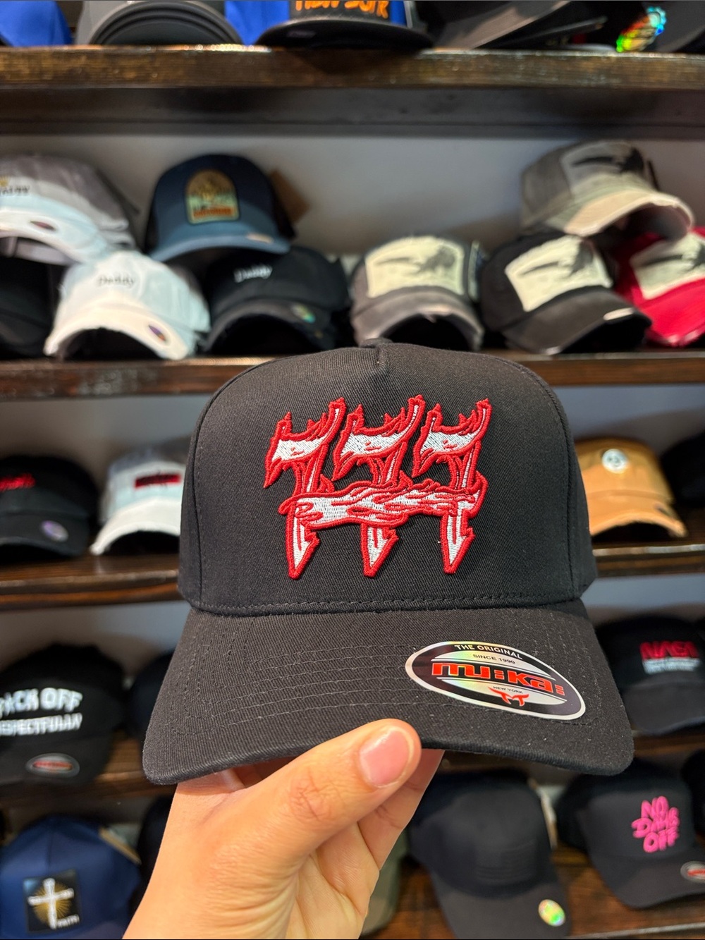 Black Trucker Hat with Red Embroidered Design